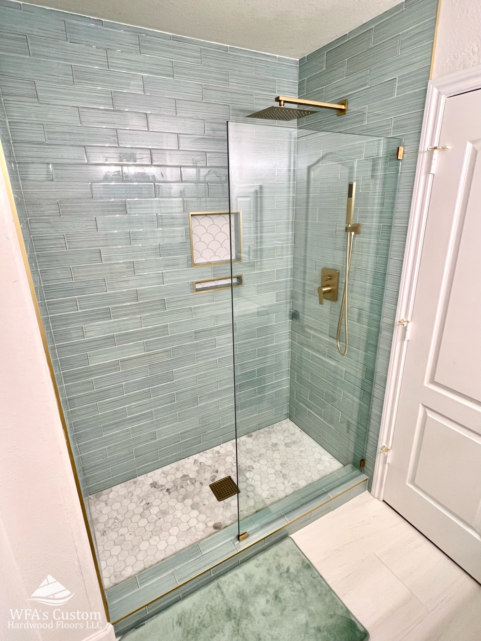 custom tile shower with custom shower glass and tile flooring, wfa's custom hardwood floors, houston texas
